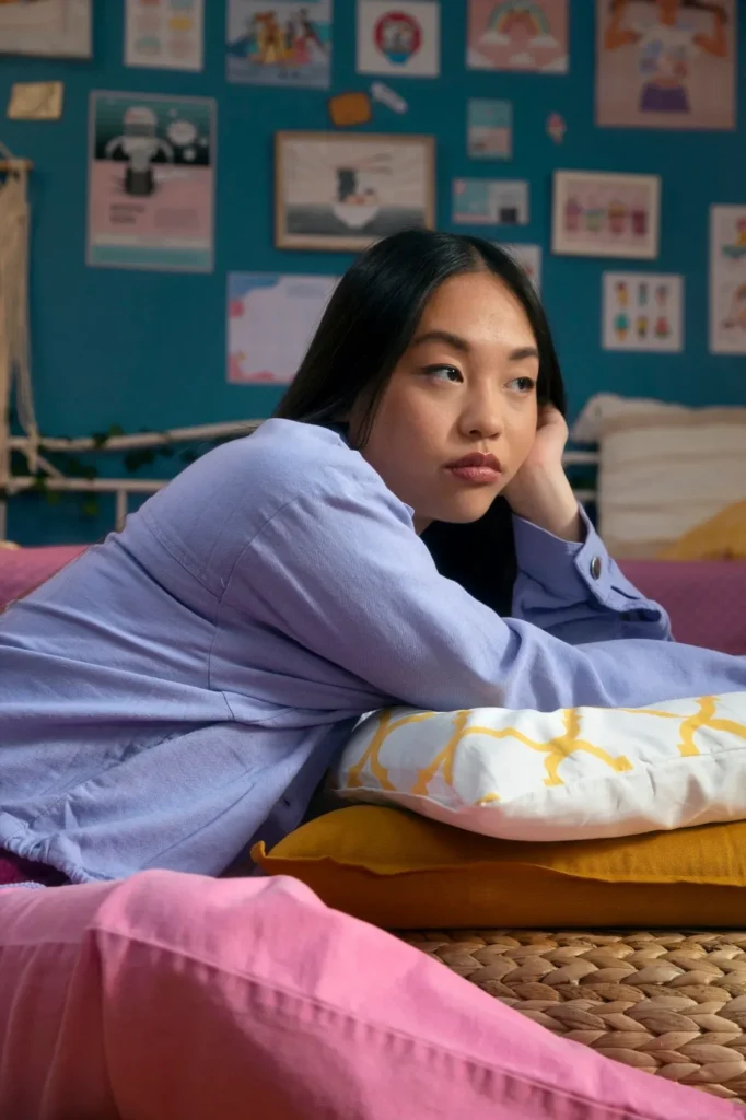 A young woman looking pensive and fatigued, representing the need for professional mood disorder treatment and psychiatric med management.